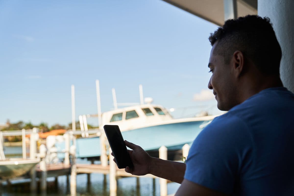 Boater using Mobile Marina app on the water