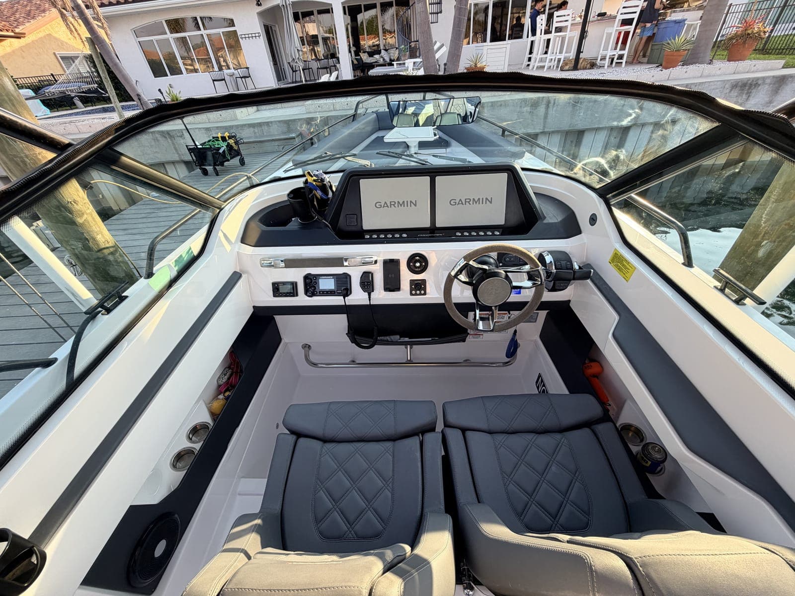 Center-console helm and seating after the interior wipe-down and vinyl clean step of a Mobile Marina full detail